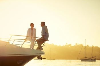 couple on boat at sunset